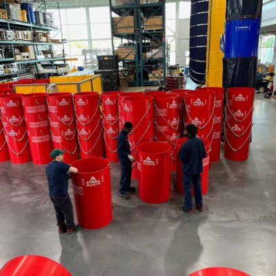 Red Superchutes being prepared for shipping.